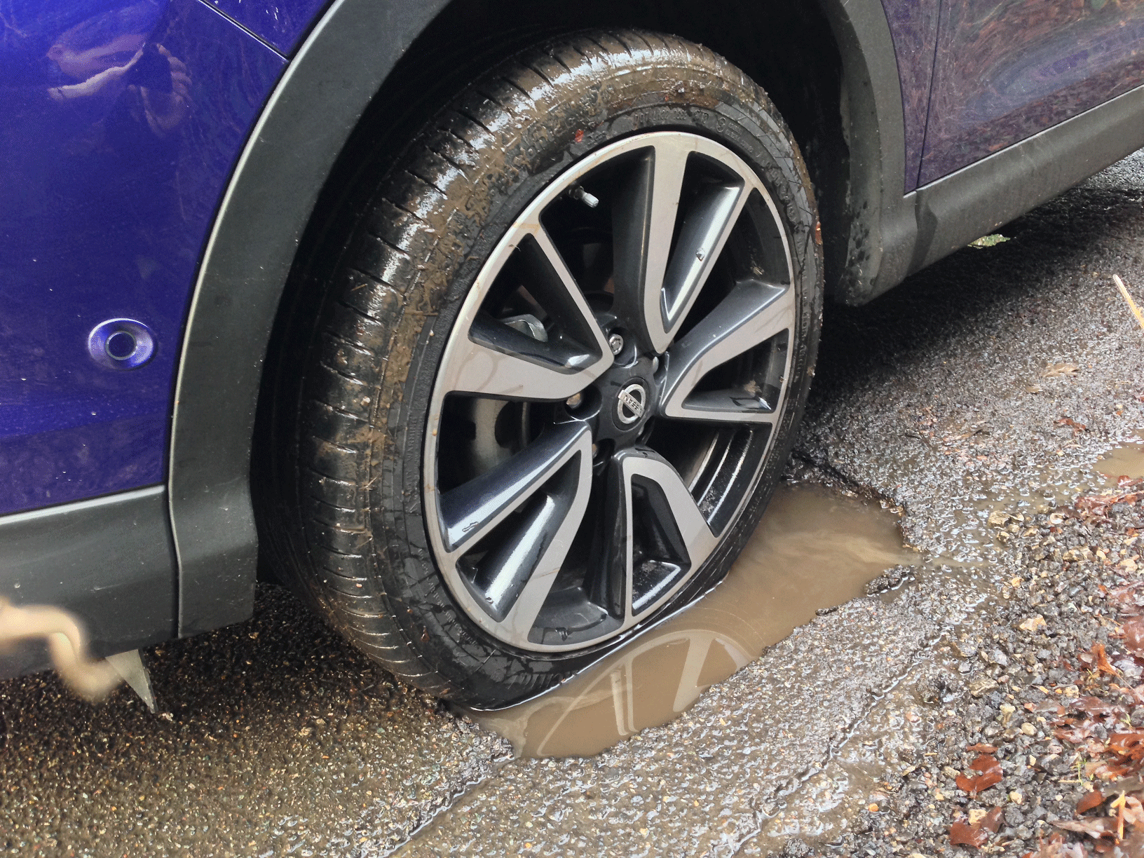 Nissan wheel in pothole