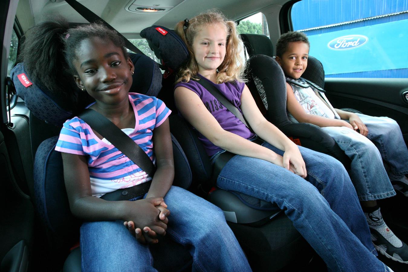 For children of three years and over, what are the seating regulations in a car?
