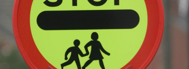 What is the Highway Code advice for a school crossing patrol?