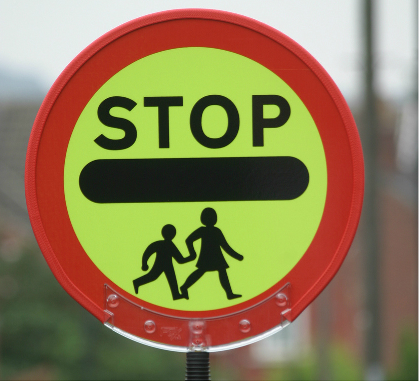 What is the Highway Code advice for a school crossing patrol?