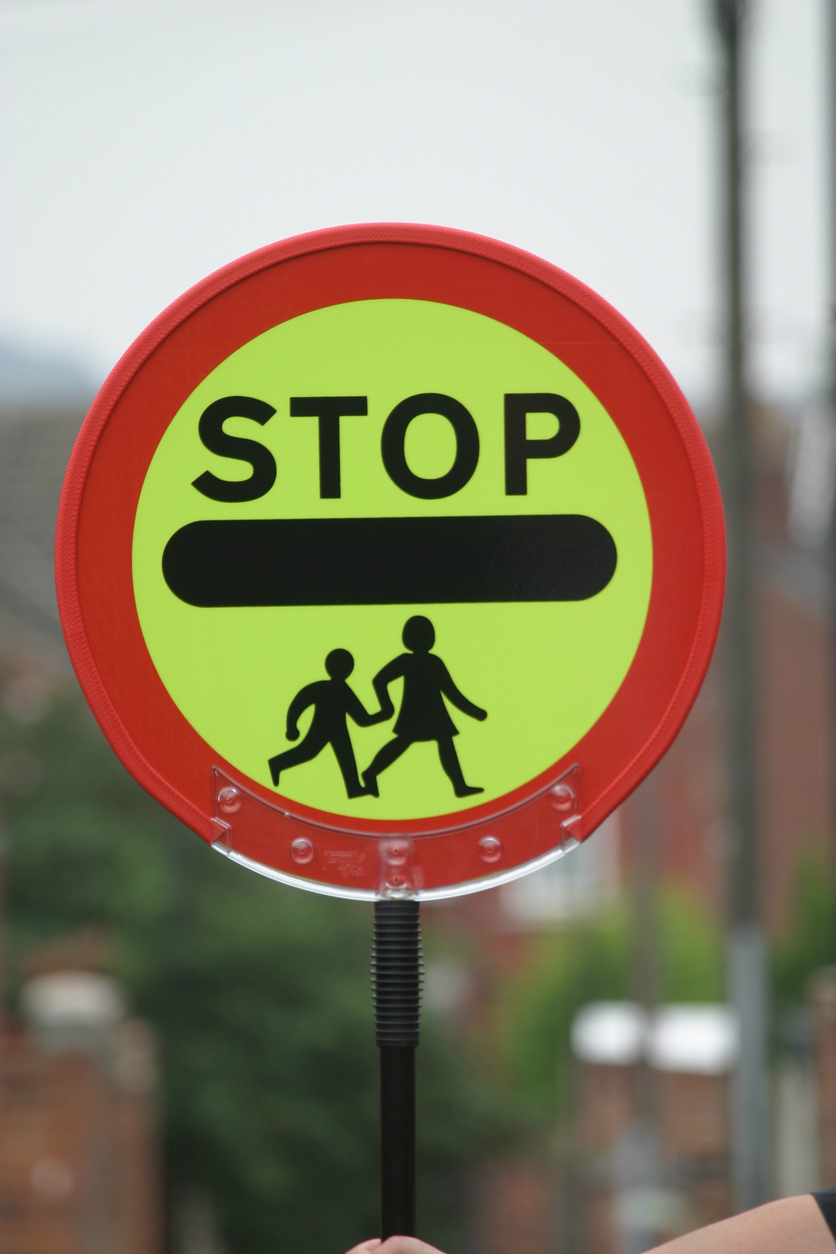 What is the Highway Code advice for a school crossing patrol?