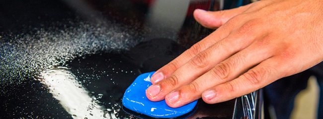 What is a clay bar used for when cleaning a car?