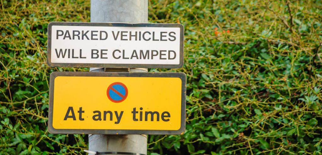 No Parking signs, including one saying that vehicles will be clamped ...